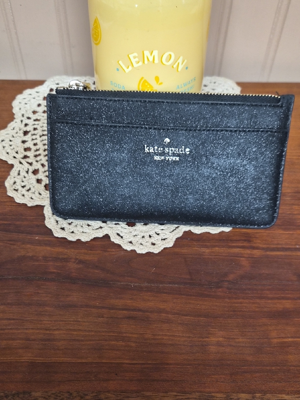kate spade black glitter zip cardholder with gold logo